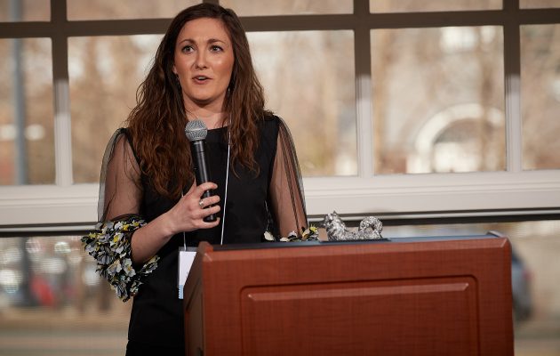 Rising Star Award winner Helena DeBald of First Year Programs and Learning Communities speaks at the UConn Spirit Awards ceremony